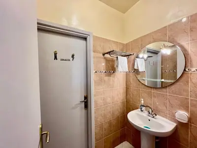 a bathroom with a sink and a mirror at NF15 by Majestic Properties in Marrakech