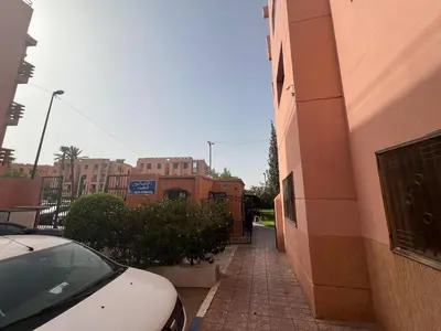 a car parked on a sidewalk next to a building at Apartment NE 4 by Majestic Properties in Marrakech