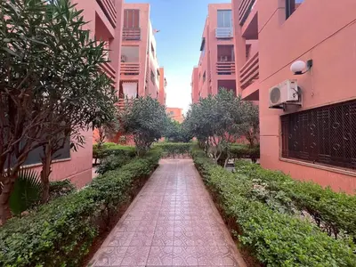 a walkway between two buildings in a city at Apartment NE 4 by Majestic Properties in Marrakech