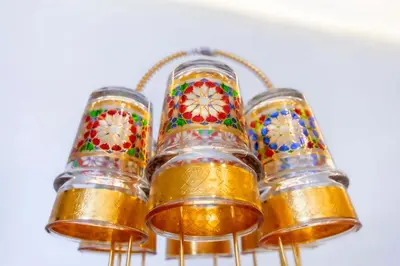 a group of glass votives with mosaics on them at Au cœur du centre ville Gueliz a coté de Carre Eden et Plaza in Marrakech