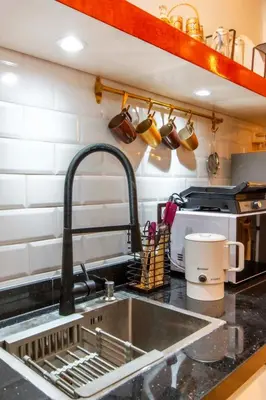 a kitchen sink with a faucet and a sink at Au cœur du centre ville Gueliz a coté de Carre Eden et Plaza in Marrakech