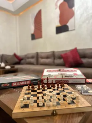 a chess board on a table in a living room at Chic stay near Gueliz - Free parking in Marrakech
