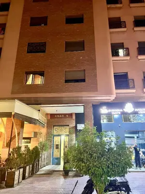 an apartment building with the entrance to a building at Appartement de luxe, Marrakech Menara in Marrakech