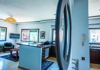 a bathroom with a counter and a sink in a room at Appartement moderne Guéliz, Centre Marrakech in Marrakech