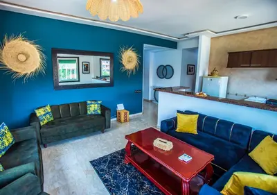 a living room with a couch and a table at Appartement moderne Guéliz, Centre Marrakech in Marrakech