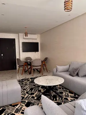 a living room with a couch and a table at Nice apartment in Marrakesh in Marrakech