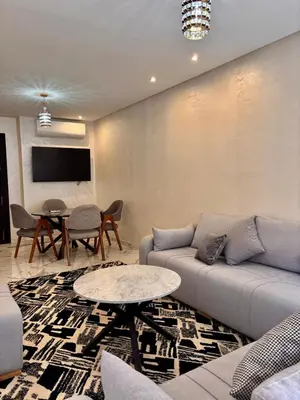 a living room with a couch and a table at Nice apartment in Marrakesh in Marrakech