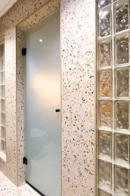 a mirror in a room with a wall covered in confetti at Luxury Studios with Balcony in Marrakech