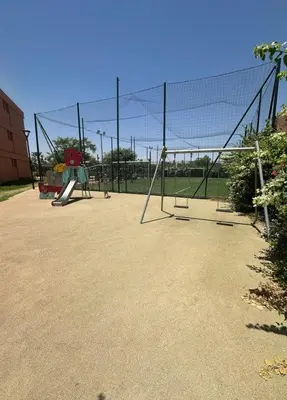 a batting cage with a net in a playground at Appartement Résidence Noria Marrakech in Marrakech