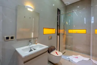 a bathroom with a sink and a shower and a toilet at Villa iganis & Spa Marrakech in Marrakech