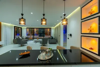 a living room with a table and chairs at Villa iganis & Spa Marrakech in Marrakech