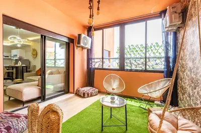 a living room with a hammock in the middle of a room at Gueliz Comfort Corner Urban Apt in Marrakech