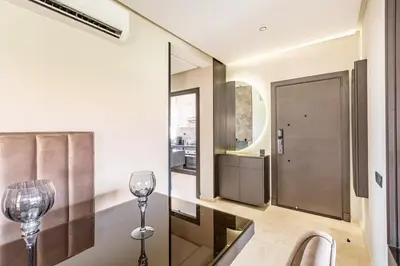 a hallway with two wine glasses and a mirror at Luxurious 3BR by to the pool in Marrakech