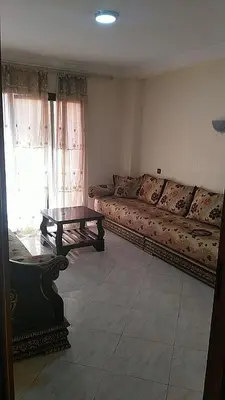 a living room with a couch and a coffee table at Marrakech Allal El Fassi in Marrakech