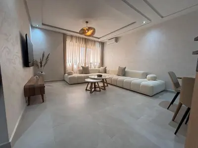 a living room with a couch and a table at Majorelle Retreat - Luxury Studio in Marrakech