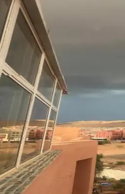 a large window of a building with a view of the desert at Cozy Flat near Gueliz in Center in Marrakech