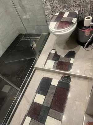 a bathroom with a toilet and a glass shower at Cozy Flat near Gueliz in Center in Marrakech