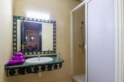 a bathroom with a sink and a mirror at Apartment for rent Wintering in Marrakech