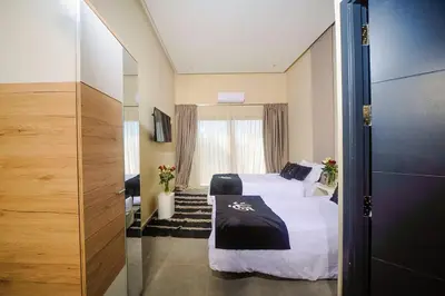 a hotel room with a bed and a window at Villa Djamila Marrakech in Marrakech