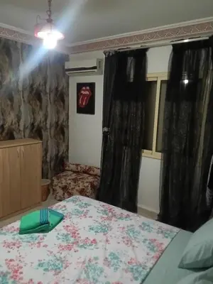 a bedroom with a bed with a fork and napkin on it at Appartement Suzette in Marrakech