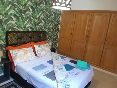 a bedroom with a bed with two pillows at Appartement Suzette in Marrakech