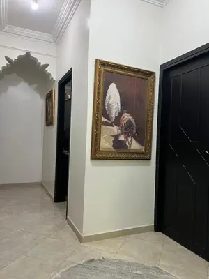 a painting on a wall next to a door at Hotel Apart LRB in Marrakech