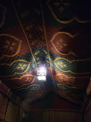 a light on a ceiling with a painting on it at Riad Hostel ADI in Marrakech
