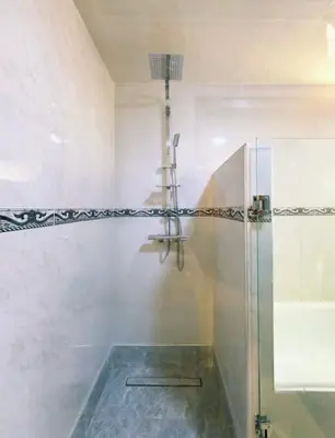 a bathroom with a shower with a glass shower stall at Villa Issil Peaceful Haven in Marrakech in Marrakech