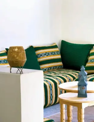 a living room with a couch and a table at Villa Issil Peaceful Haven in Marrakech in Marrakech