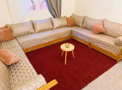 a living room with a couch and a table at Villa Issil Peaceful Haven in Marrakech in Marrakech