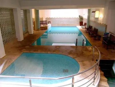 a large swimming pool in a building at apartment in the center of Guéliz in Marrakech