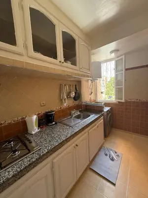 a kitchen with a sink and a counter top at Appartement Aeropuerto in Marrakech