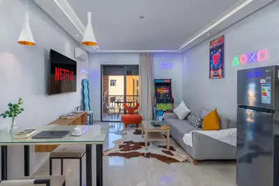 a living room with a couch and a table at -New- Appartement stylé au cœur de Marrakech in Marrakech