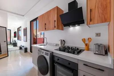 a kitchen with a stove and a stove top oven at Apartment in Guéliz with cozy terrace in Marrakech