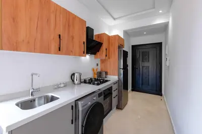 a kitchen with a sink and a stove at Apartment in Guéliz with cozy terrace in Marrakech