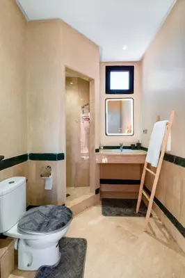 a bathroom with a toilet and a sink at Apartment in Guéliz with cozy terrace in Marrakech