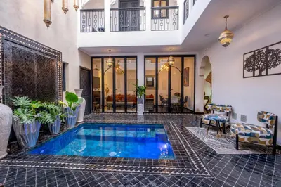 a swimming pool in the middle of a house at Riad Sahelia in Marrakech