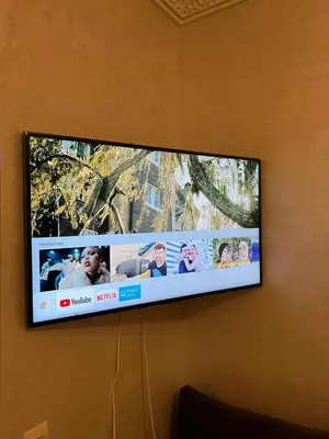 a flat screen tv hanging on a wall at Appartement Marrakech au 1er étage in Marrakech
