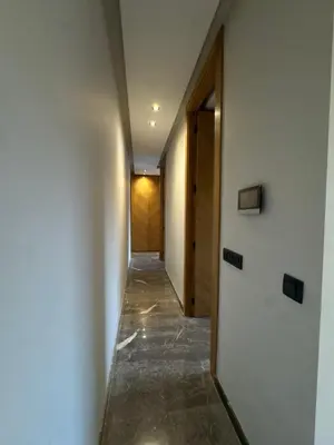 a hallway of a house with white walls at Appartement Gueliz Elite garden in Marrakech