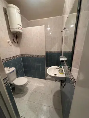 a bathroom with a toilet and a sink at Appartement Layane Votre havre de paix à deux pas de Guéliz in Marrakech