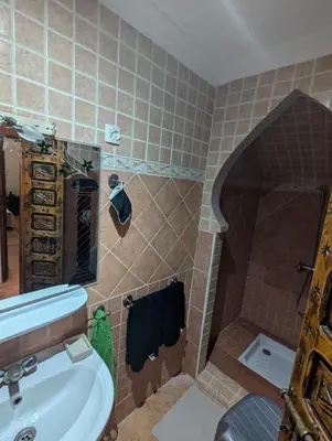 a bathroom with a sink and a toilet at Atelier des Reeves in Marrakech