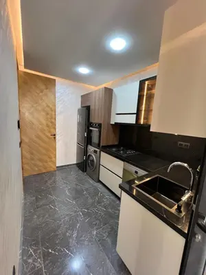 a small kitchen with a sink and a stove at Elite Garden Grand Studio Luxe in Marrakech
