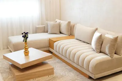 a living room with two couches and a table at New cozy 2 bedroom apartment with 3 ACs close to airport and center in Marrakech