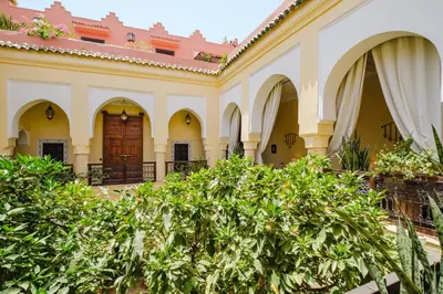 a building with a tree in front of it at Riad Alzira Jardin Secret Au coeur De La Medina in Marrakech
