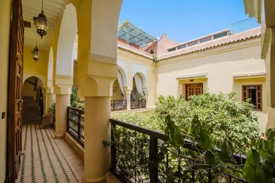 a hallway of a house with a balcony at Riad Alzira Jardin Secret Au coeur De La Medina in Marrakech