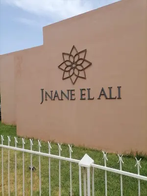 a sign on the side of a building at jnane ali akioud Gueliz in Marrakech
