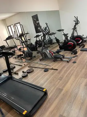 a gym with a bunch of exercise bikes on the floor at jnane ali akioud Gueliz in Marrakech