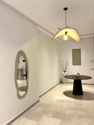 a room with a table and a mirror at Magnifique appartement à Guéliz, résidence de luxe in Marrakech
