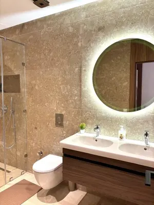 a bathroom with a sink and a toilet and a mirror at Magnifique appartement à Guéliz, résidence de luxe in Marrakech