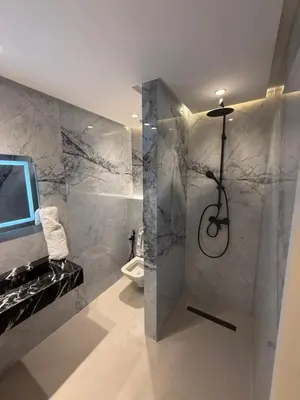 a bathroom with a shower and a toilet at Appartement moderne in Marrakech